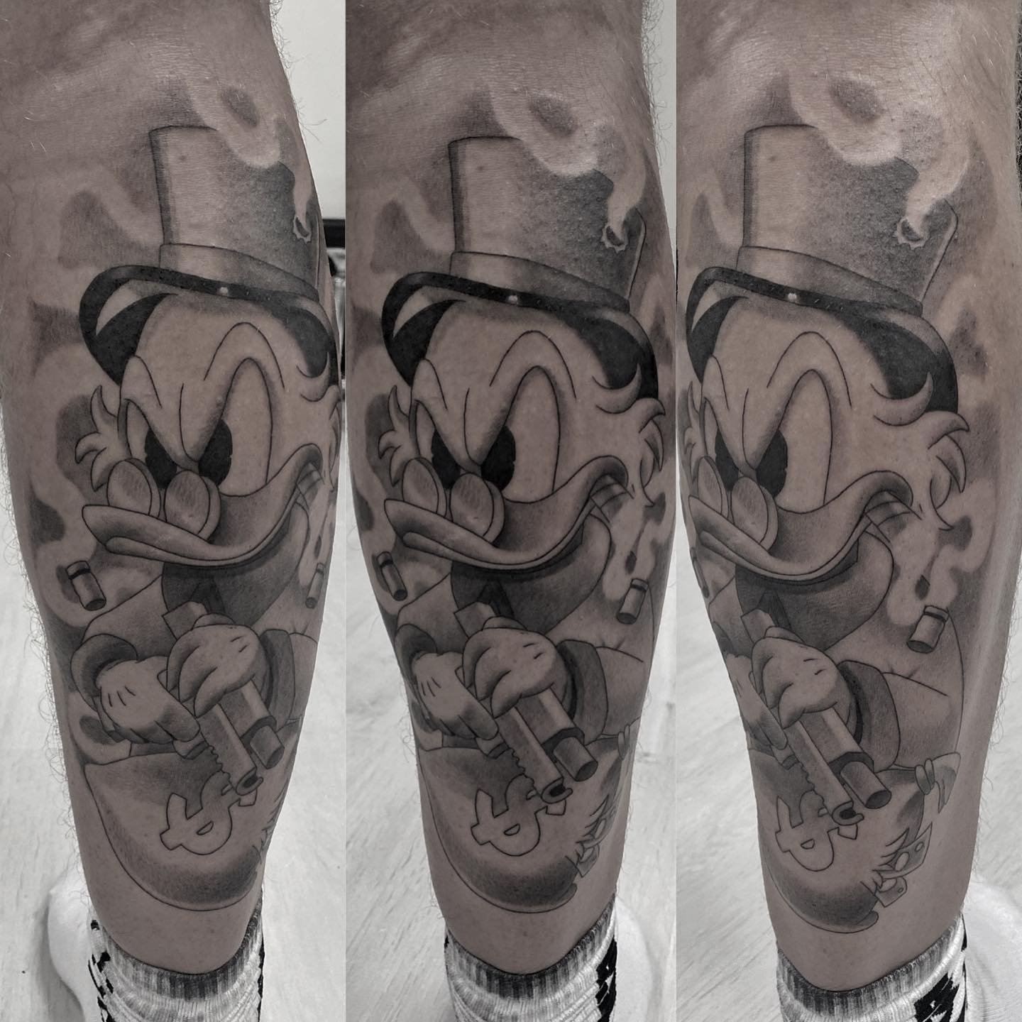 Custom geometric tattoo design on upper arm
